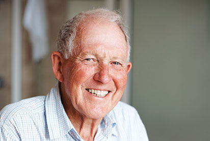 Photo of a man smiling. Link to Life Stage Gift Planner Over Age 65 Situations.
