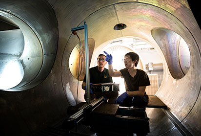 Students working on a plasma vacuum chamber. Links to Gifts by Will Students working on a plasma vacuum chamber. Links to Gifts by Will